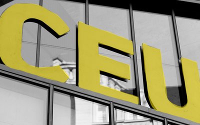 Three yellow letter showing a C, E and U. 