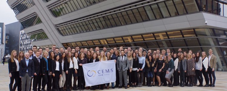 A big group of students from the CEMS Clubs in front of the WU Vienna