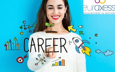 A young woman points at the written word "career"