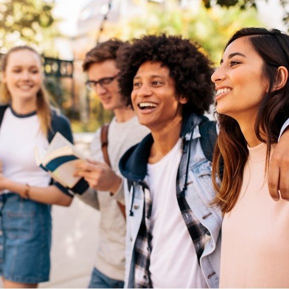 A group of young students smiling
