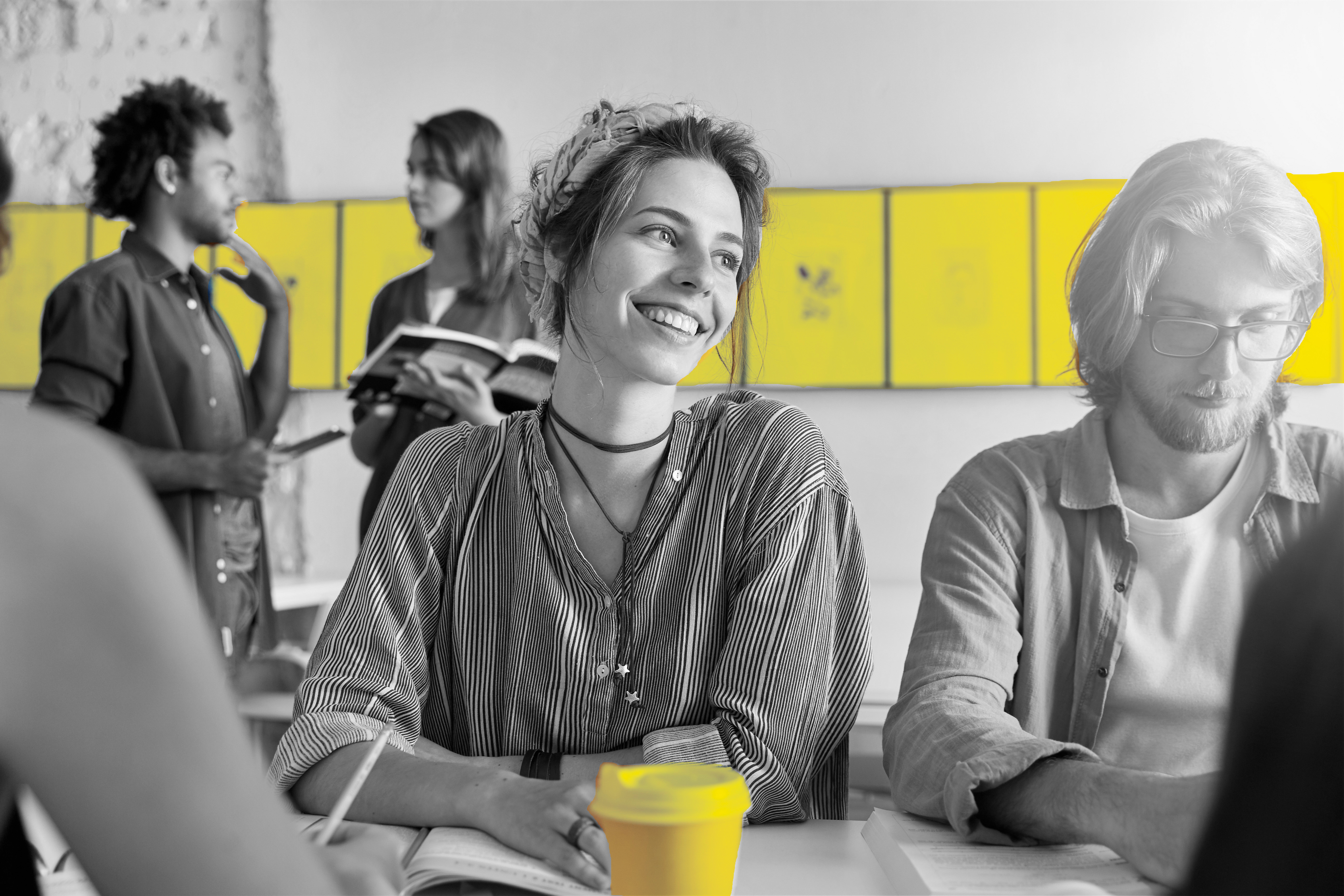 A female student and a male student are sitting together while learning.